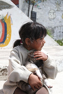 young girl holding a puppy