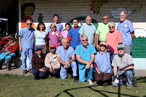 Entire dental team posing together