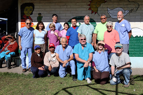 Entire dental team posing together