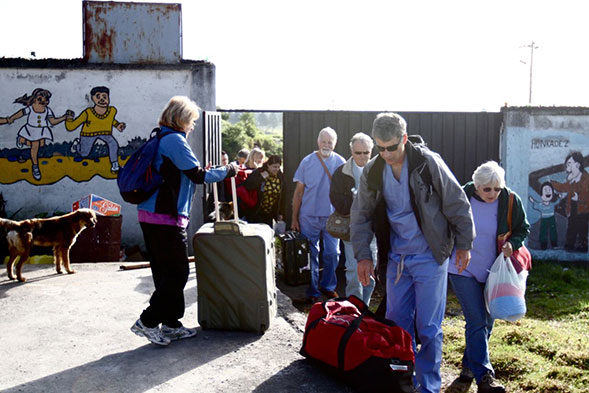 dentists holding luggage