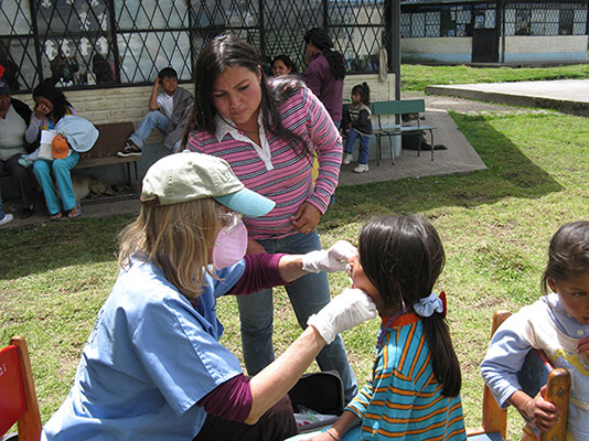young girl receiving dental care