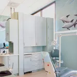 blue dental suite with mural of dolphins