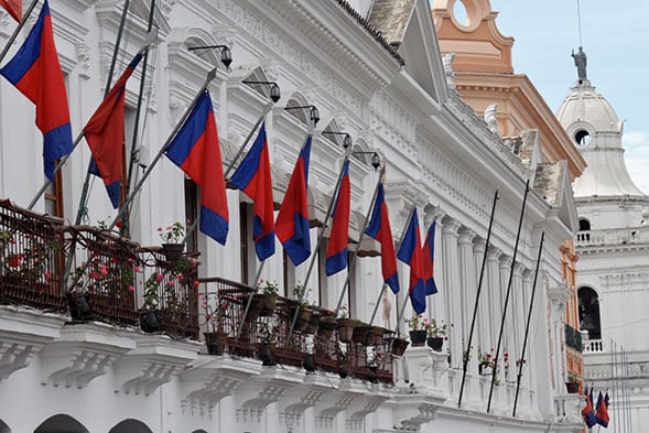 Flags in front of a building balcony