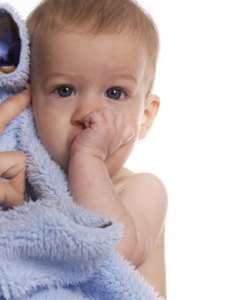 a baby sucking it's thumb