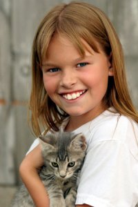 girl holding a cat